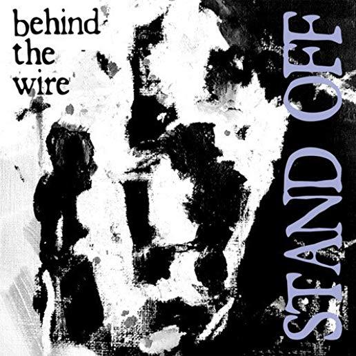 BEHIND THE WIRE